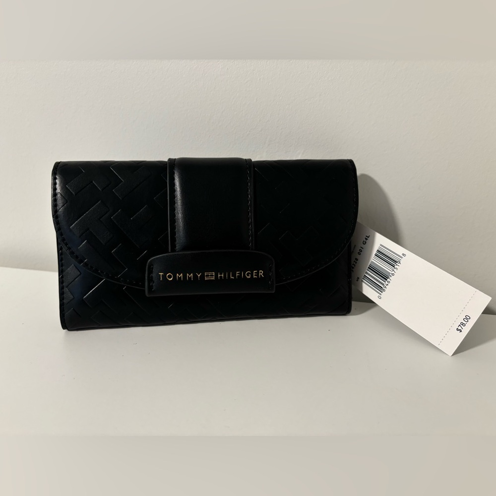 Never used. Tommy Hilfiger wallet (retail price is 78)